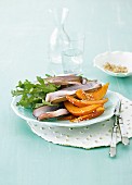 Razor clams with a rocket salad and pumpkin wedges