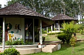 Guest huts with painted wall in Beluga School for Life, Thailand