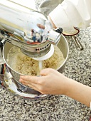 Mixing dough in kneading machine