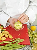 Applying lime on artichoke