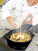 Adding ingredients in pan