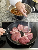 Frying veal cheeks in frying pan