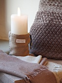 Close-up of burning candle and fashion Cashmere from Umbrian, Italy