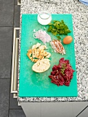 Ingredients for preparation of stuffed peppers on cutting board