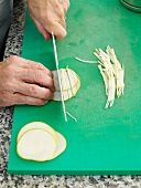 Cutting thin slices of apple