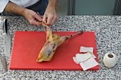 Removing skin of pheasant