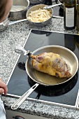 Stuffed pheasant in frying pan