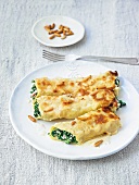 Cannelloni filled with spinach, ricotta, pine nuts and parmesan cream