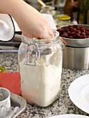 Removing flour from glass jar