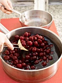 Adding cherry to mixture in saucepan