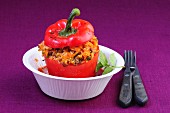 A red pepper filled with rice and minced meat