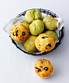Green rolls and savory muffins in bread basket