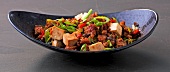 Tofu with black beans and hack in serving dish