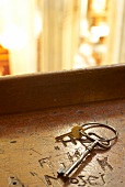 Close-up of keychain on wood surface in Admont Collegiate Church in Styria, Austria