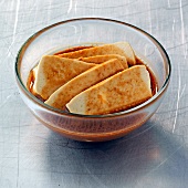 Slices of tofu with Japanese marinade in bowl