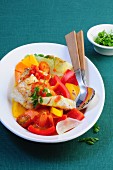 Warm fish salad with peppers and a saffron dressing