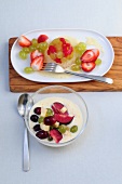 Strawberry and grape salad on plate with zabaione desert in bowl