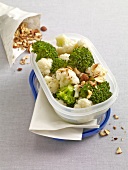 Broccoli salad with hazelnut dressing in plastic box