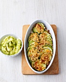 Bowl of pesto puree and crunchy zucchini in serving dish