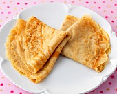 Close-up of folded pancakes on plate