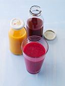 Smoothies made ??from fruit juice in bottles and glass