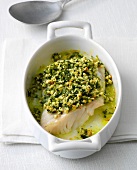 Fish with crunchy dressing in serving bowl