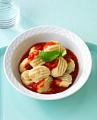 Gnocchi with tomato sauce in bowl