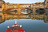 View of Ponte Vecchio from boat in Florence, Italy