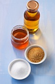 Various sweeteners in jar, bottle and bowls