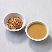 Sesame seeds and tahini in bowls