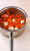 Close-up of various diced vegetables in pan, step 1