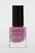 Close-up of max effect mini nail polish in pink colour