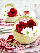 Close-up of melon gratin garnished with flowers on tray