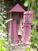 Gardening tools in shed painted pink