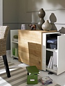 Sideboard with angled sliding doors against grey wall