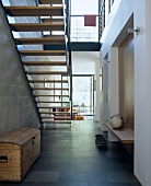 Entrance hall of modern house with staircase and steel cheeks
