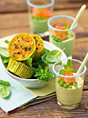 Herbs frittata in muffin tins and peas cream with salmon in glass