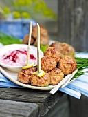 Meat balls with cranberry dip in serving dish