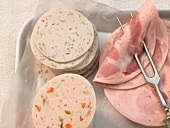 Close-up of various cooked cold sausage cuts