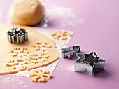 Close-up of dough with snowflakes shaped cookie cutter
