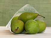 Close-up of green pears in paper bag