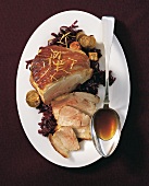 Roast pork with red cabbage on plate