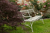 White metal bench in garden