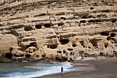 Tourists at Matala Caves near beach in Iraklion, Crete, Greek