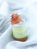 Melon smoothie with ham jelly in glass