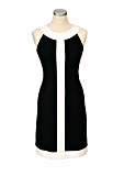 Close-up of black dress with white stripe on mannequin
