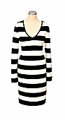 Close-up of striped and knitted black-white dress on mannequin