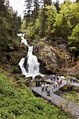 Tourists at waterfall in Triberg, Black Forest, Germany
