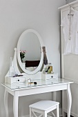 White cosmetic table with mirror in Scandinavian style