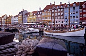 View of bars and restaurants in Nyhavn harbour in Copenhagen, Denmark